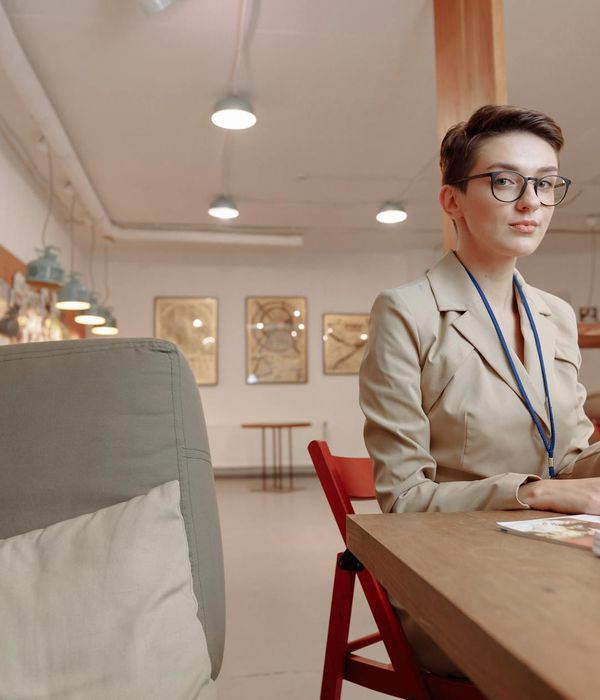 Person at a desk looking calm and focused after a short break.
